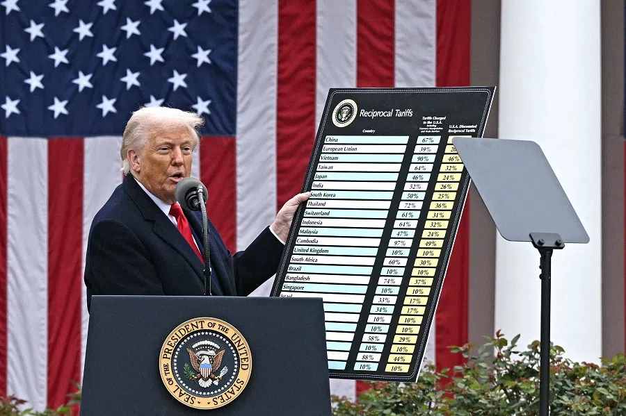 US President Donald Trump delivers remarks on reciprocal tariffs while holding a chart during an event in the Rose Garden entitled “Make America Wealthy Again” at the White House in Washington, DC, on 2 April 2025. (Brendan Smialowski/AFP)