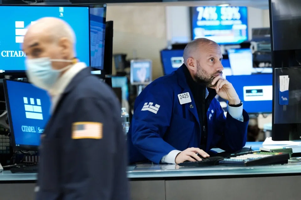 Traders work on the floor of the New York Stock Exchange (NYSE) on 15 November 2021 in New York City. (Spencer Platt/AFP)