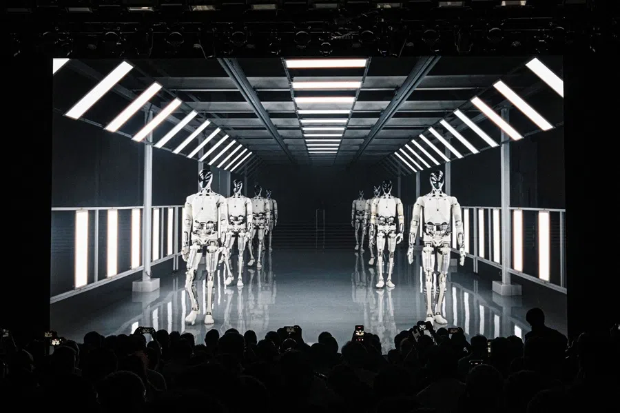 People look at a video clip of Xpeng's next-gen IRON humanoid robot during AI Day at its headquarter in Guangzhou, China, on 5 November 2025. (Jade Gao/AFP)