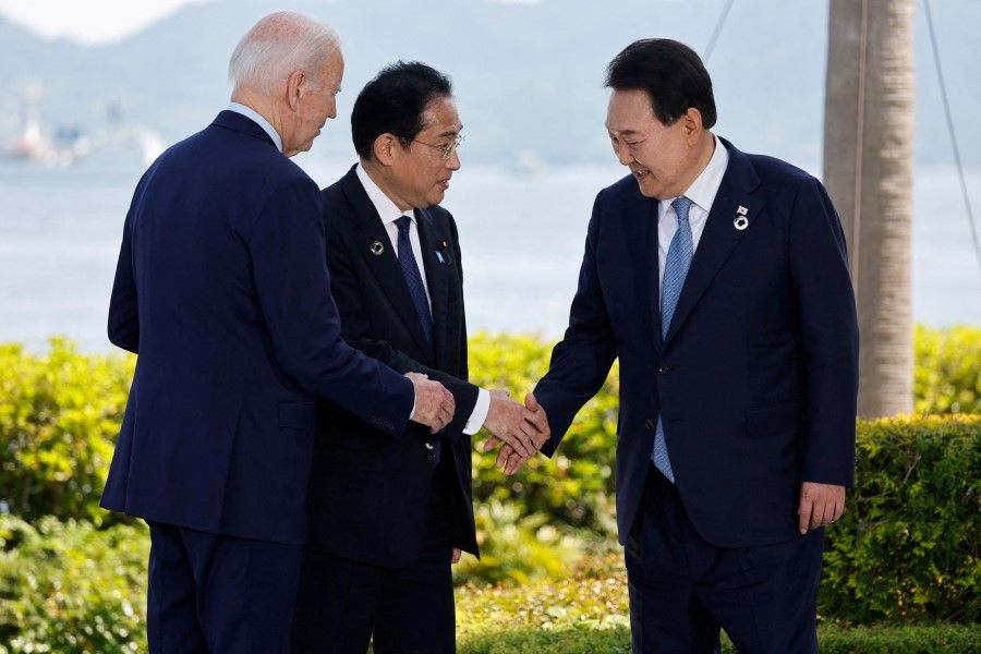 US President Joe Biden, Japan's Prime Minister Fumio Kishida and South Korea's President Yoon Suk-yeol attend a photo op on the day of trilateral engagement during the G7 Summit at the Grand Prince Hotel in Hiroshima, Japan, on 21 May 2023. (Jonathan Ernst/Reuters)