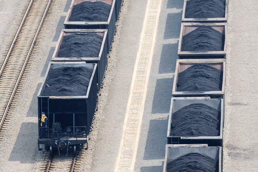 This photo taken on 2 July 2022 shows coal loaded on trains at a coal plant in Huaibei, in China's eastern Anhui province. (AFP)