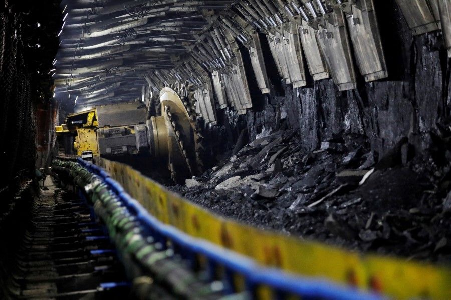 A shearer is pictured at an underground coalface at Xiaobaodang Coal Mine during an organised media tour, in Shenmu of Yulin city, Shaanxi province, China, 26 April 2023. (Tingshu Wang/Reuters)