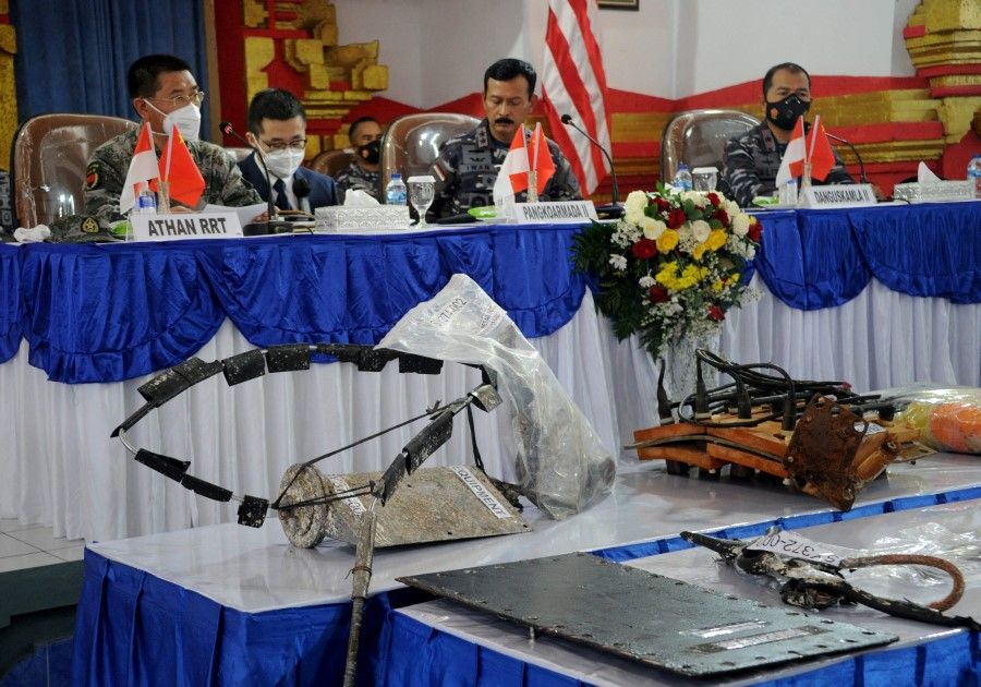 Equipment from Nanggala 402 submarine are displayed during joint press conference between Indonesia and China on Lanal base in Denpasar, on Indonesia resort island of Bali, 18 May 2021. (Sonny Tumbelaka/AFP)