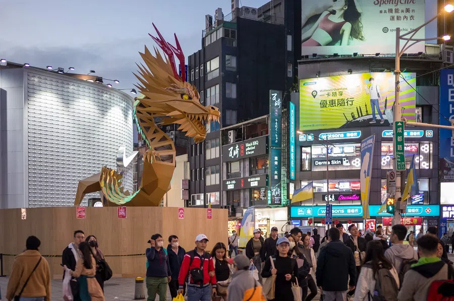 People walk at Ximen District in Taipei, Taiwan, on 3 February 2024. (Sam Yeh/AFP)
