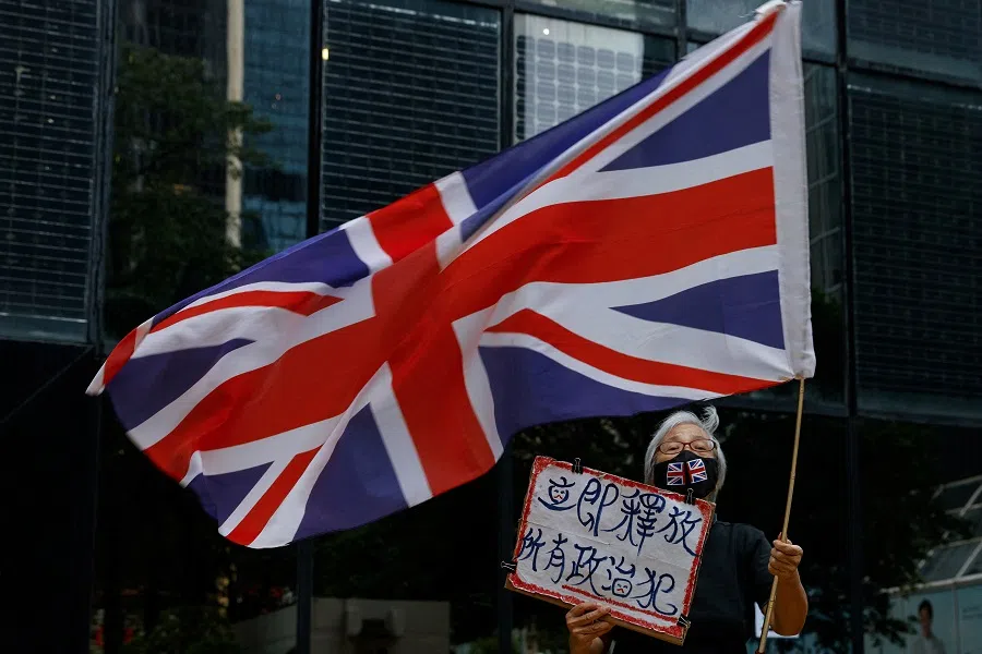 A supporter waves the Union Jack flag outside the District Court during the hearing of media mogul Jimmy Lai, founder of Apple Daily, in Hong Kong, China, 24 November 2022. (Tyrone Siu/Reuters)