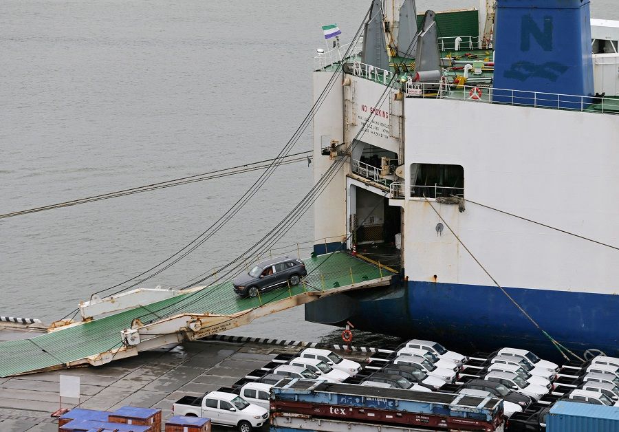 A new car produced by Chinese automaker Geely leaves a ship at a commercial port in Vladivostok, Russia, 25 August 2023. (Tatiana Meel/Reuters)