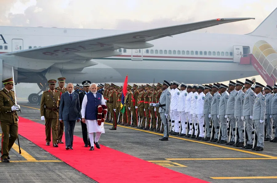 India’s Prime Minister Narendra Modi is received by his Mauritius counterpart Navinchandra Ramgoolam during his state visit, at the Sir Seewoosagur Ramgoolam International Airport in Plaine Magnien, Mauritius, on 11 March 2025. (Reuters)