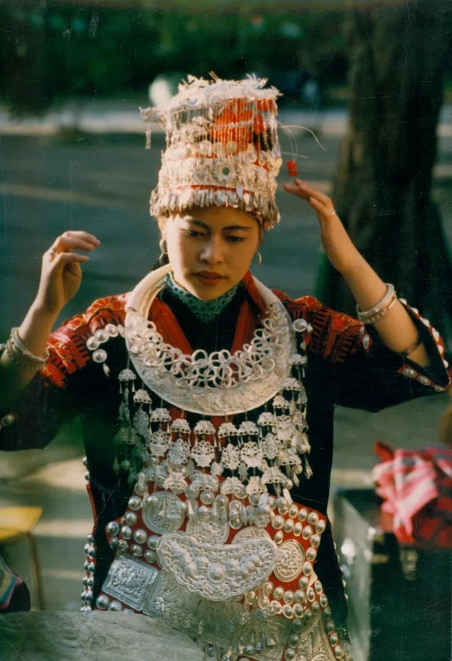 A Miao girl in Guizhou wearing wedding attire, 1988.
