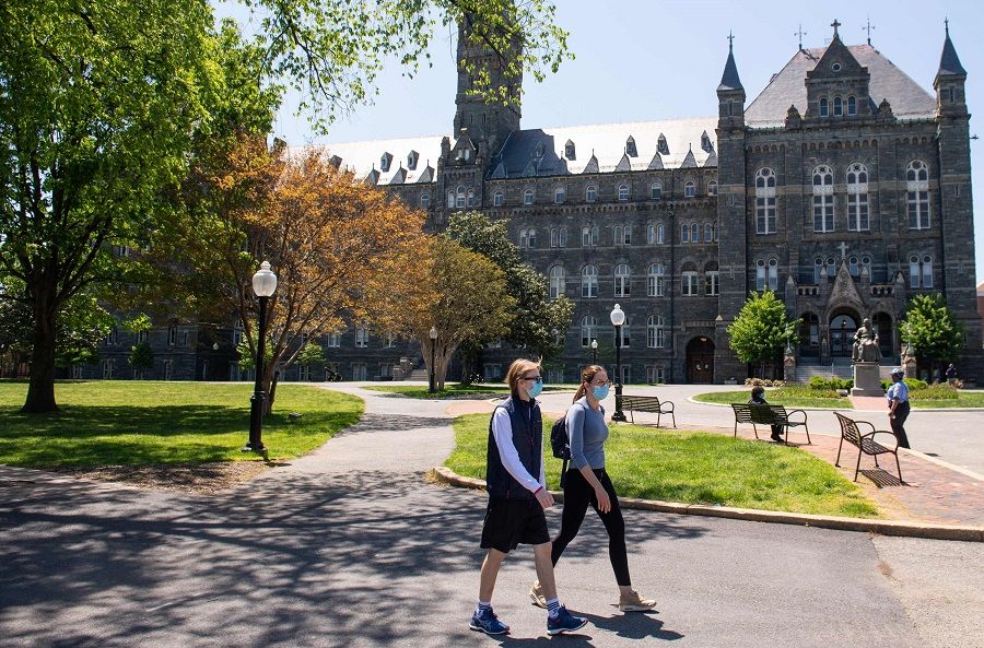 In this file photo taken on 7 May 2020, the campus of Georgetown University is seen nearly empty as classes were cancelled due to the Covid-19 pandemic, in Washington, DC. (Saul Loeb/AFP)
