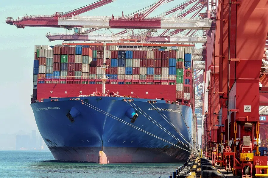 A cargo ship loaded with containers is seen at a port in Qingdao, Shandong province, China, on 7 September 2022. (AFP)
