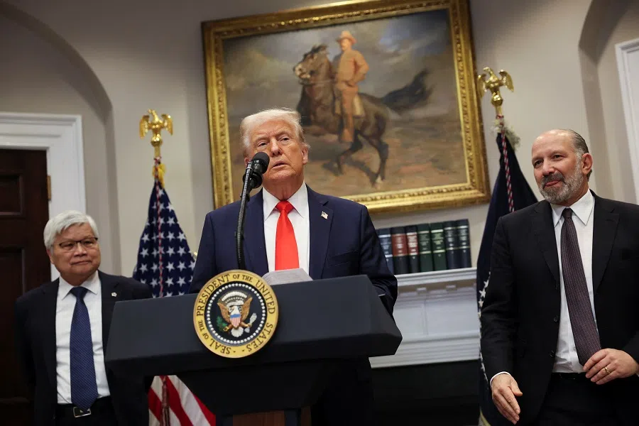 US President Donald Trump makes an announcement about an investment from Taiwan Semiconductor Manufacturing Company (TSMC), flanked by CC Wei, chairman and CEO of TSMC, and  Commerce Secretary Howard Lutnick, in the Roosevelt Room at the White House in Washington, DC, US, 3 March 2025. (Leah Millis/Reuters)