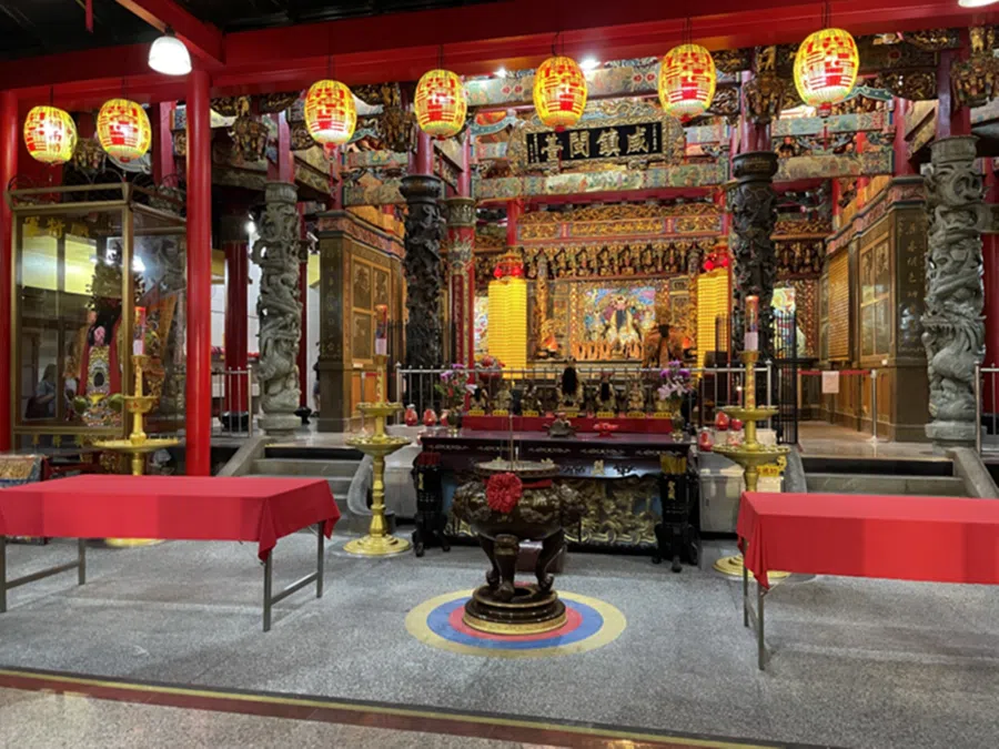 People now bring their own offerings to the temple and place the items on a table prepared by the temple staff, Taiwan. 