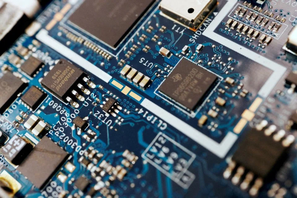 Semiconductor chips are seen on a circuit board of a computer in this illustration picture taken 25 February 2022. (Florence Lo/Reuters)