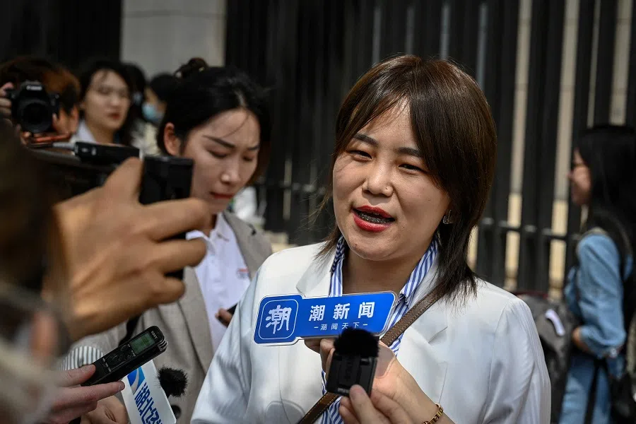 Teresa Xu, also known as Xu Zaozao, speaks to the media before a second hearing of her case suing a Beijing hospital for refusing to freeze her eggs on the basis that she is unmarried, at the Beijing Third Intermediate People's Court in Beijing, China on 9 May 2023. (Jade Gao/AFP)