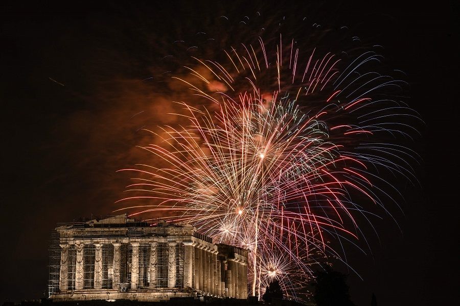 Fireworks explode over the Acropolis during New Year celebrations in Athens, early on 1 January 2024. (Angelos Tzortzinis/AFP)