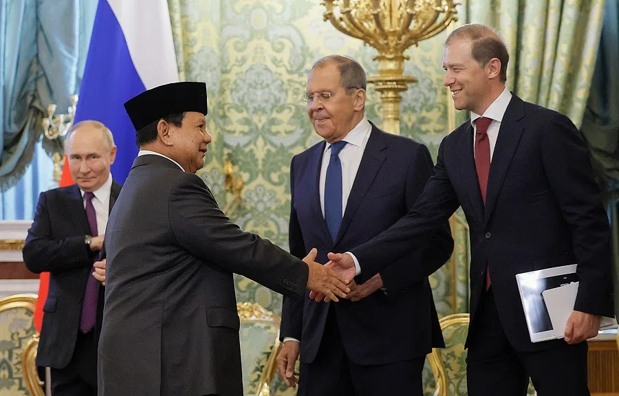Indonesia’s President-elect Prabowo Subianto (second from left) shakes hands with Russia’s First Deputy Prime Minister Denis Manturov (right) as Russia’s Foreign Minister Sergei Lavrov (second from right) looks on prior to a meeting with Russia’s President Vladimir Putin (left) at the Kremlin in Moscow, Russia, on 31 July 2024. (Maxim Shemetov/AFP)