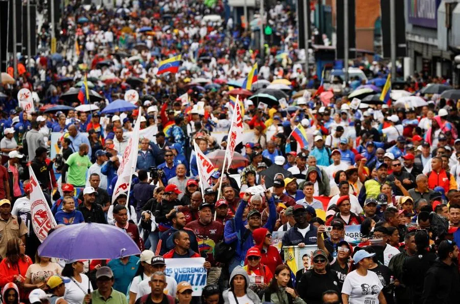 Demonstrators march to demand the release of captured President Nicolás Maduro and his wife Cilia Flores, following their capture by US forces during US strikes on Venezuela, in Caracas, Venezuela, 14 January 2026. (Fausto Torrealba/Reuters)
