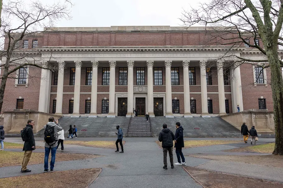 People gather outside Widener Library on Harvard University’s campus on 17 March 2025 in Cambridge, Massachusetts. (Scott Eisen/AFP)
