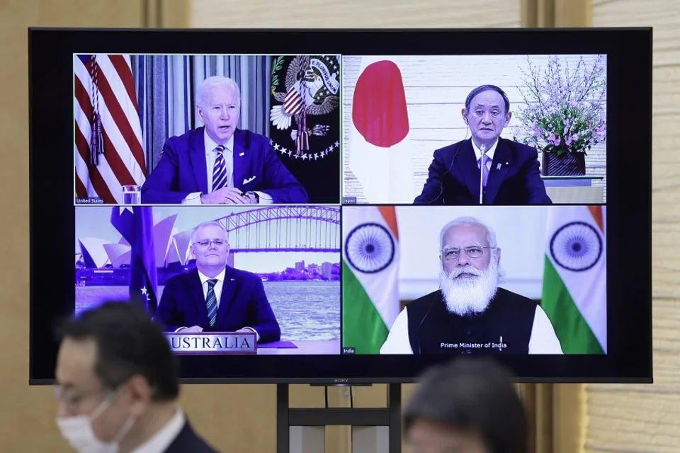 U.S. President Joe Biden (top left), Yoshihide Suga, Japan's prime minister (top right), Scott Morrison, Australia's prime minister (bottom left), and Narendra Modi, India's prime minister, on a monitor during the virtual Quadrilateral Security Dialogue (Quad) meeting at Suga's official residence in Tokyo, Japan, on 12 March 2021. (Kiyoshi Ota/Bloomberg)