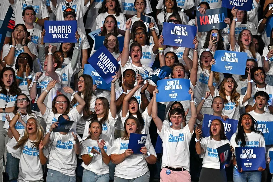 Supporters of US Vice-President and Democratic presidential candidate Kamala Harris cheer at a campaign event in Greensboro, North Carolina, on 12 September 2024. (Jim Watson/AFP)