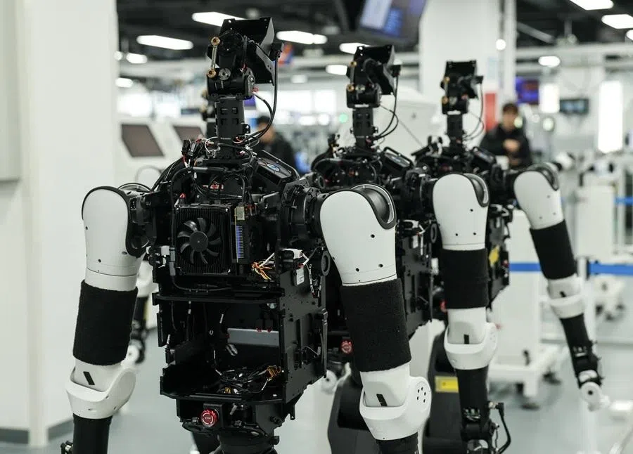 Humanoid robots appear at the production line during organized media tour to the Robotics Pilot Testing and Validation Platform of Beijing Innovation Center of Humanoid Robotics (X-Humanoid) in Beijing, China, on 20 March 2026.