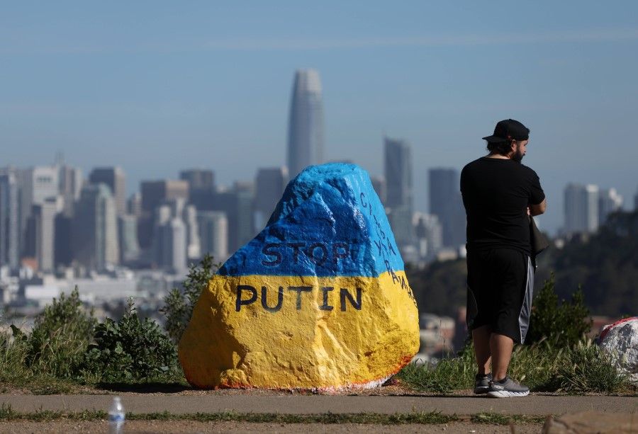 A rock is painted with the colors of the Ukraine flag and the message "Stop Putin" on 9 March 2022 in San Francisco, California. A large rock has been painted near Bernal Heights Park to show solidarity for Ukraine as Russia continues its invasion. (Justin Sullivan/AFP)