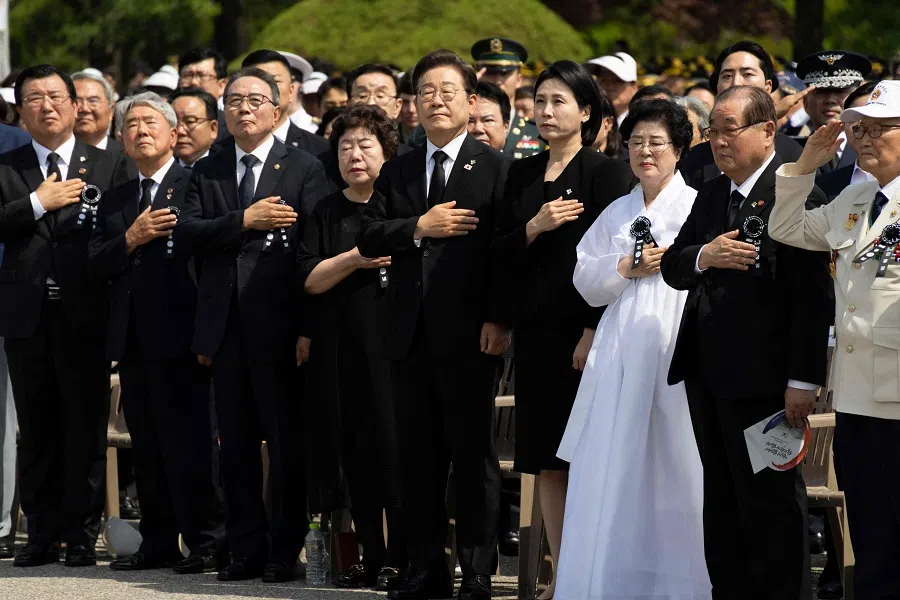 South Korean President Lee Jae-myung (centre) and his wife Kim Hye-Kyung (fourth from right) at a ceremony to mark the 70th Memorial Day at the Seoul National Cemetery in Seoul on 6 June 2025. (Jeon Heon-kyun/AFP)