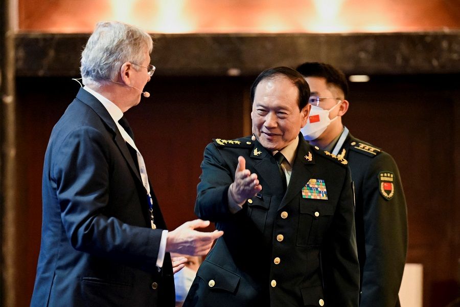 China's State Councilor and Defence Minister General Wei Fenghe gestures before a plenary session during the 19th Shangri-La Dialogue in Singapore, 12 June 2022. (Caroline Chia/Reuters)