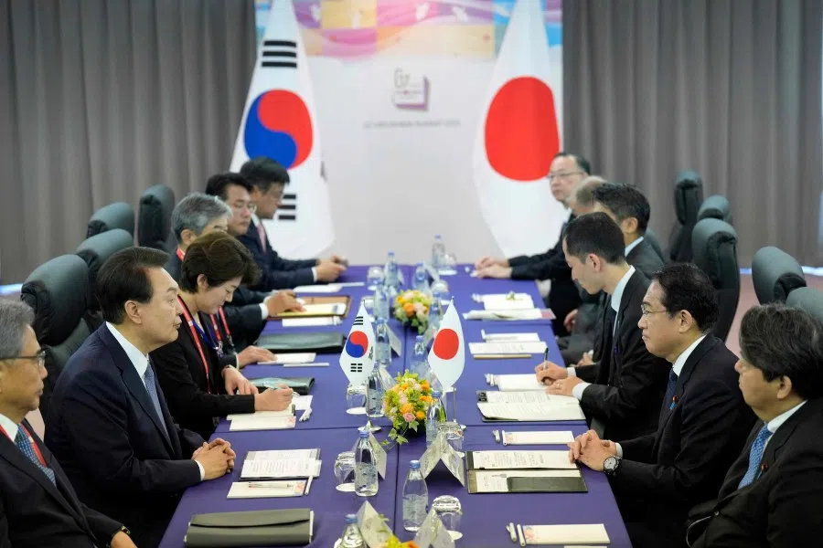 Japan’s Prime Minister Fumio Kishida (second from right) and South Korean President Yoon Suk-yeol (second from left) attend a bilateral meeting as part of the G7 Leaders’ Summit in Hiroshima on 21 May 2023. (Hiro Komae/AFP)