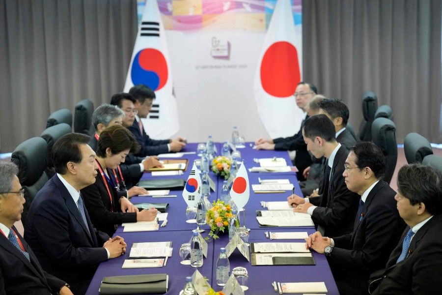 Japan's Prime Minister Fumio Kishida (second from right) and South Korean President Yoon Suk Yeol (second from left) attend a bilateral meeting as part of the G7 Leaders' Summit in Hiroshima on 21 May 2023. (Hiro Komae/AFP)