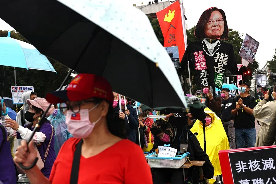 Supporters of Taiwan's main opposition party the Kuomintang (KMT) join the annual Autumn Struggle labour protest, focusing on its opposition to the government's decision to allow imports of US pork containing ractopamine, an additive that enhances leanness, and other issues related to the referendum in Taipei, Taiwan, 12 December 2021. (Ann Wang/Reuters)