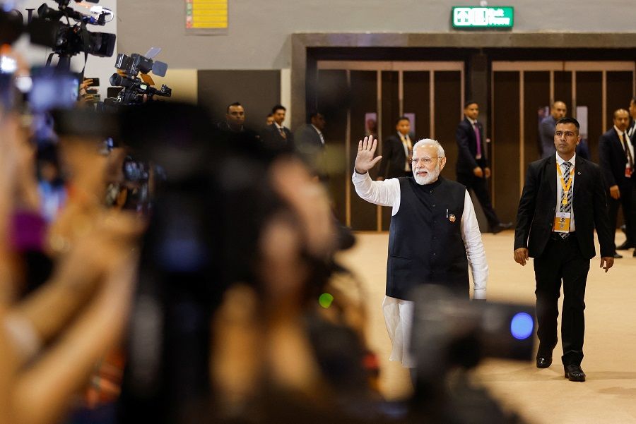 Indian Prime Minister Narendra Modi waves as he visits the International Media Centre in New Delhi, India, on 10 September 2023. (Amit Dave/Reuters)