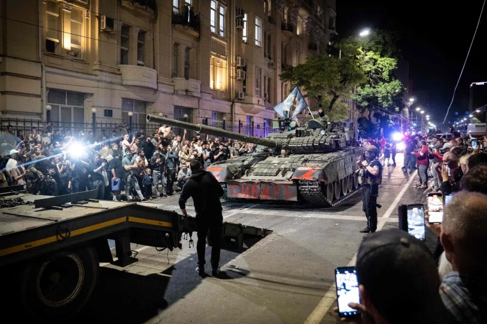 Members of Wagner group prepare to pull out from the headquarters of the Southern Military District to return to their base in Rostov-on-Don late on 24 June 2023. Rebel mercenary leader Yevgeny Prigozhin who sent his fighters to topple the military leaders in Moscow will leave for Belarus and a criminal case against him will be dropped as part of a deal to avoid "bloodshed," the Kremlin said on 24 June. (Roman RomokhovAFP)