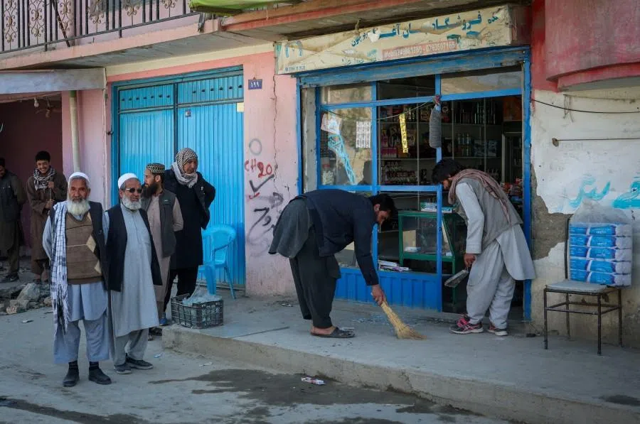 People remove shattered glass from their shop, following Pakistani airstrike, in the Darul Aman locality, in Kabul, Afghanistan, 27 February 2026. (Sayed Hassib/Reuters)
