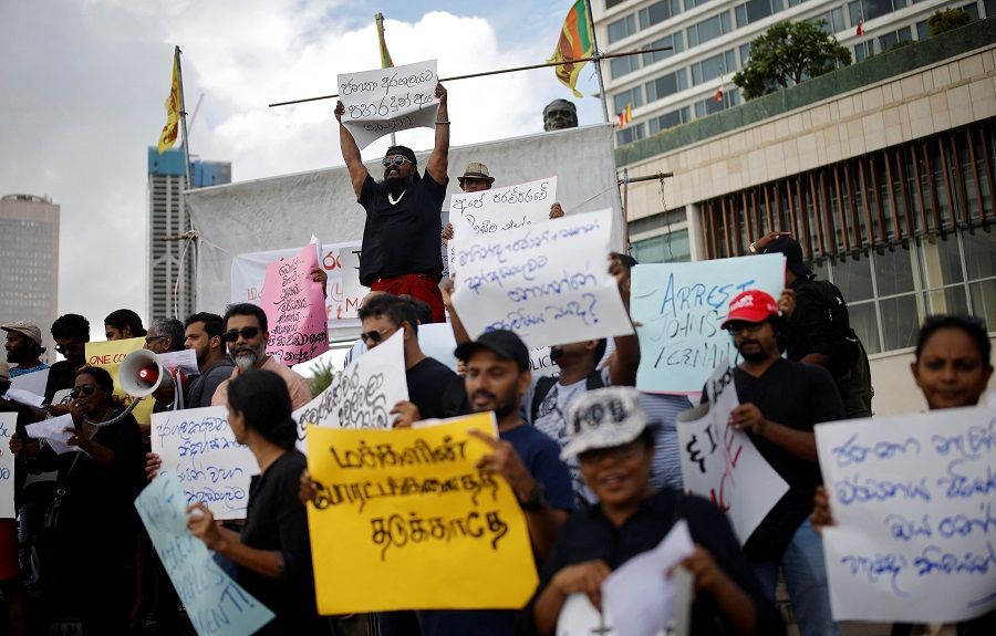 Anti-government demonstrators hold placards as they shout slogans during a protest demanding the arrest of former Prime Minister Mahinda Rajapaksa, amid the country's economic crisis, in Colombo, Sri Lanka, 17 May 2022. (Adnan Abidi/Reuters)