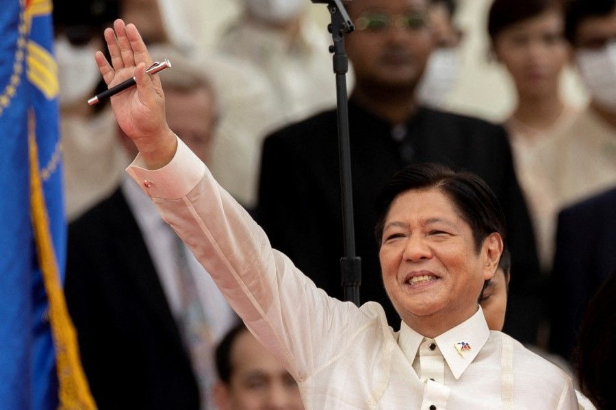 Ferdinand "Bongbong" Marcos Jr. waves to the audience after taking oath as the 17th President of the Philippines during the inauguration ceremony at the National Museum in Manila, Philippines, 30 June 2022. (Eloisa Lopez/Reuters)