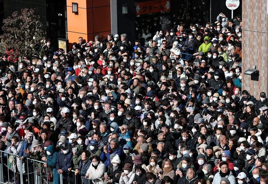 People wait for the arrival of Japan’s Prime Minister Sanae Takaichi on the day of an election campaign event in Higashimatsuyama, Saitama prefecture, Japan, on 3 February 2026. (Kim Hyung-Hoon/Reuters)