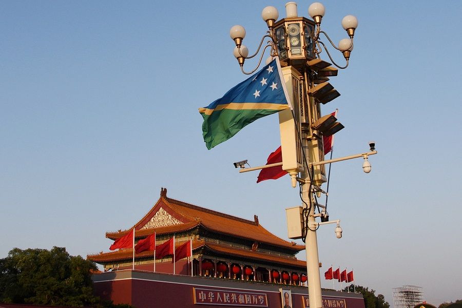 National flags of the Solomon Islands and China flutter at Tiananmen Square in Beijing, China, 7 October 2019. (Stringer/File Photo/Reuters)