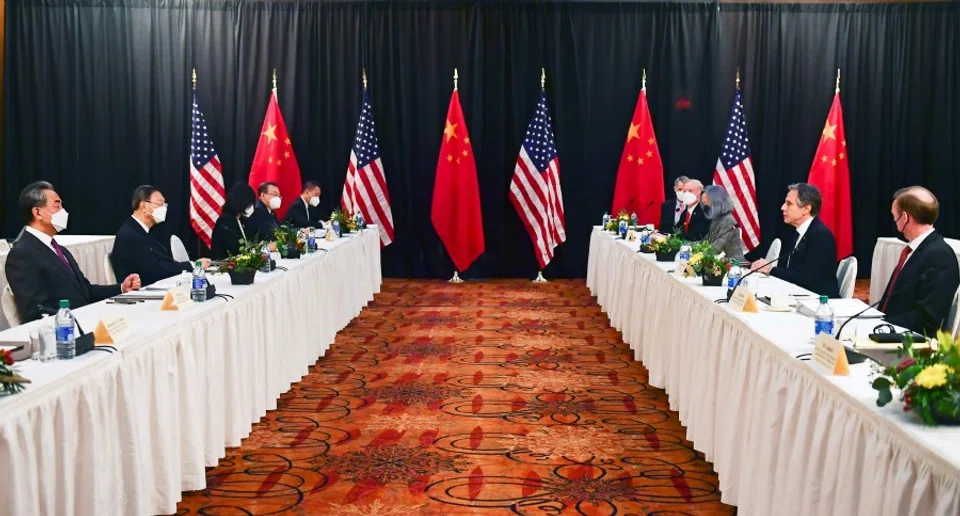 US Secretary of State Antony Blinken (second from right) and national security adviser Jake Sullivan (right) speak with Politburo member and Director of the Office of the Central Commission for Foreign Affairs Yang Jiechi (second from left) and State Councilor and Foreign Minister Wang Yi (left) at the opening session of US-China talks at the Captain Cook Hotel in Anchorage, Alaska, US, 18 March 2021. (Frederic J. Brown/Pool via Reuters)