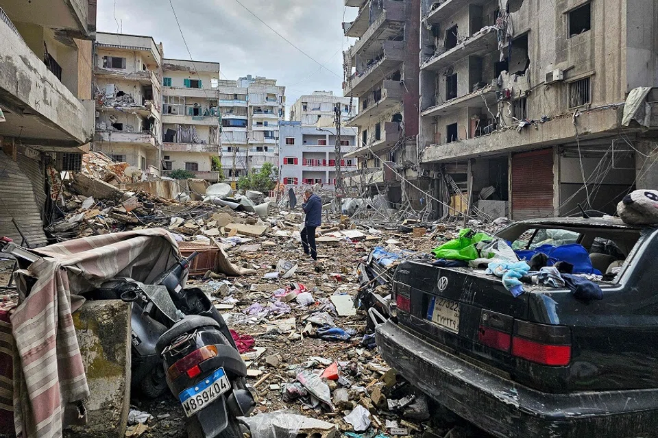 A man walks amid destruction in Beirut’s southern Haret Hreik neighbourhood a day after an Israeli airstrike targeted the site, on 18 November 2024, as the war between Israel and Lebanon’s Hezbollah group continues. (AFP)