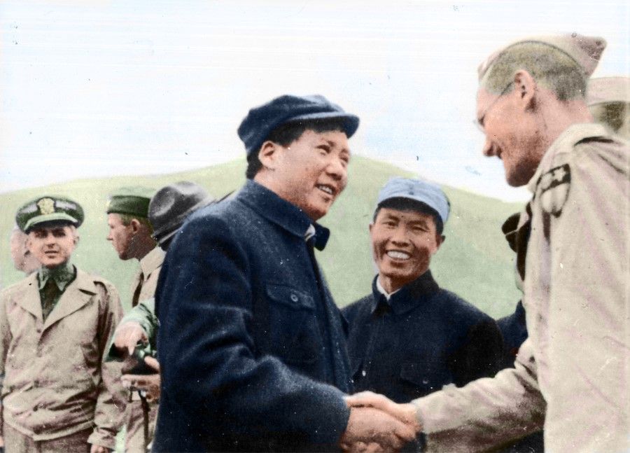 Mao Zedong shaking hands with Dixie Mission members at a decoration ceremony for Colonel David D. Barrett, October 1944.