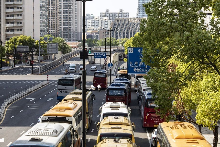 Idle coach buses line a road during a lockdown due to Covid-19 in Shanghai, China, 5 May 2022. (Bloomberg)