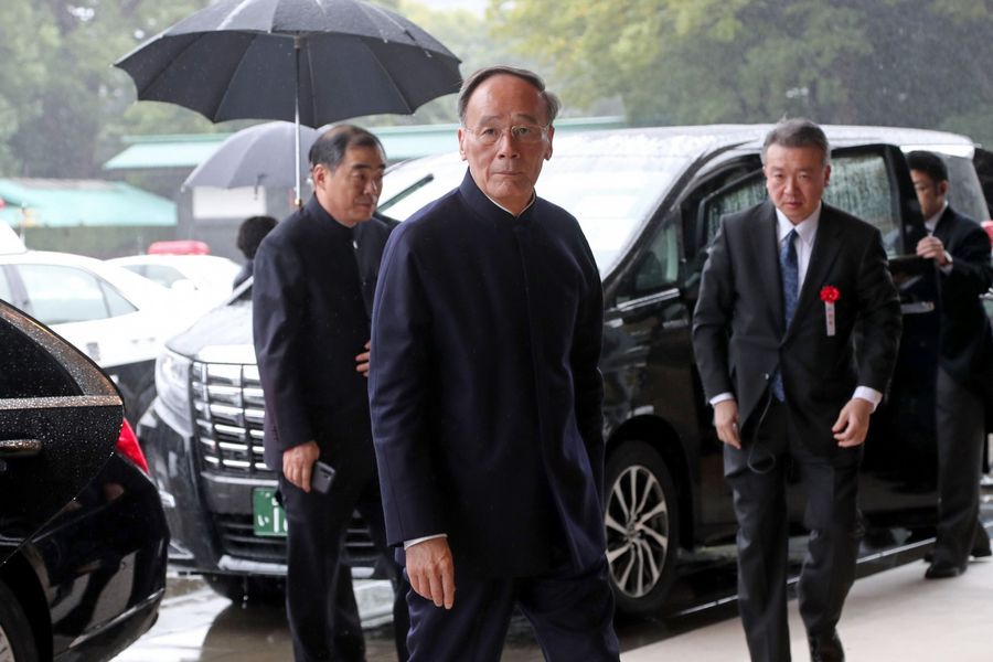 China's Vice President Wang Qishan arriving at the Imperial Palace to attend the proclamation ceremony of Japan's Emperor Naruhito's ascension to the throne in Tokyo on October 22, 2019. (Koji Sasahara/POOL/AFP)