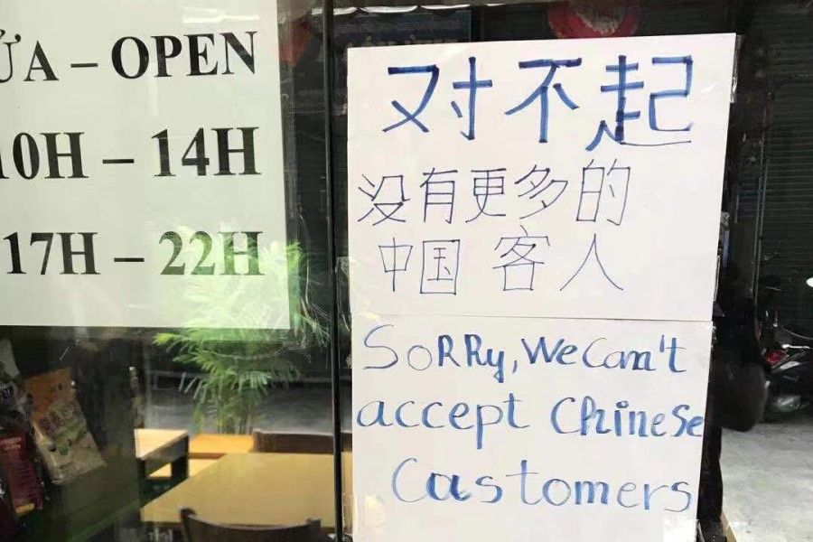 A sign at a restaurant in Vietnam. The Chinese text says: "Sorry, no (more) Chinese customers." (@StephenMcDonell/Twitter)