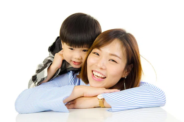 82673477 - asian mother and her son indoor portrait