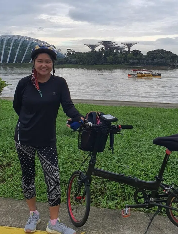Linda, who now enjoys cycling regularly, lost about 31kg** in seven months. Credit: Linda Kong