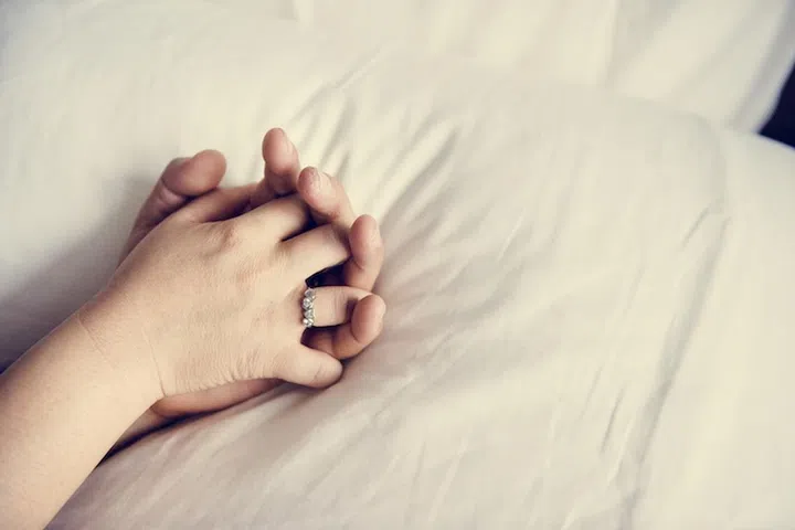 Couple holding hands