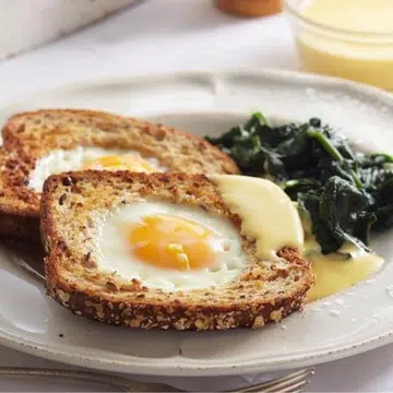 Eggs In Bread With Wilted Spinach & Hollandaise Sauce