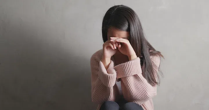  Depression woman crying over gray background 