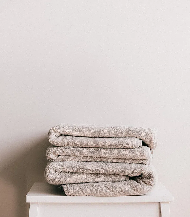 Nothing says spa like a fluffy towel, robe and slippers. (Photo by Karolina Grabowska from Pexels)